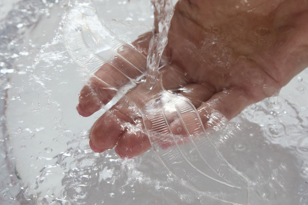 Hand washing the innovative brow stencil with water.
