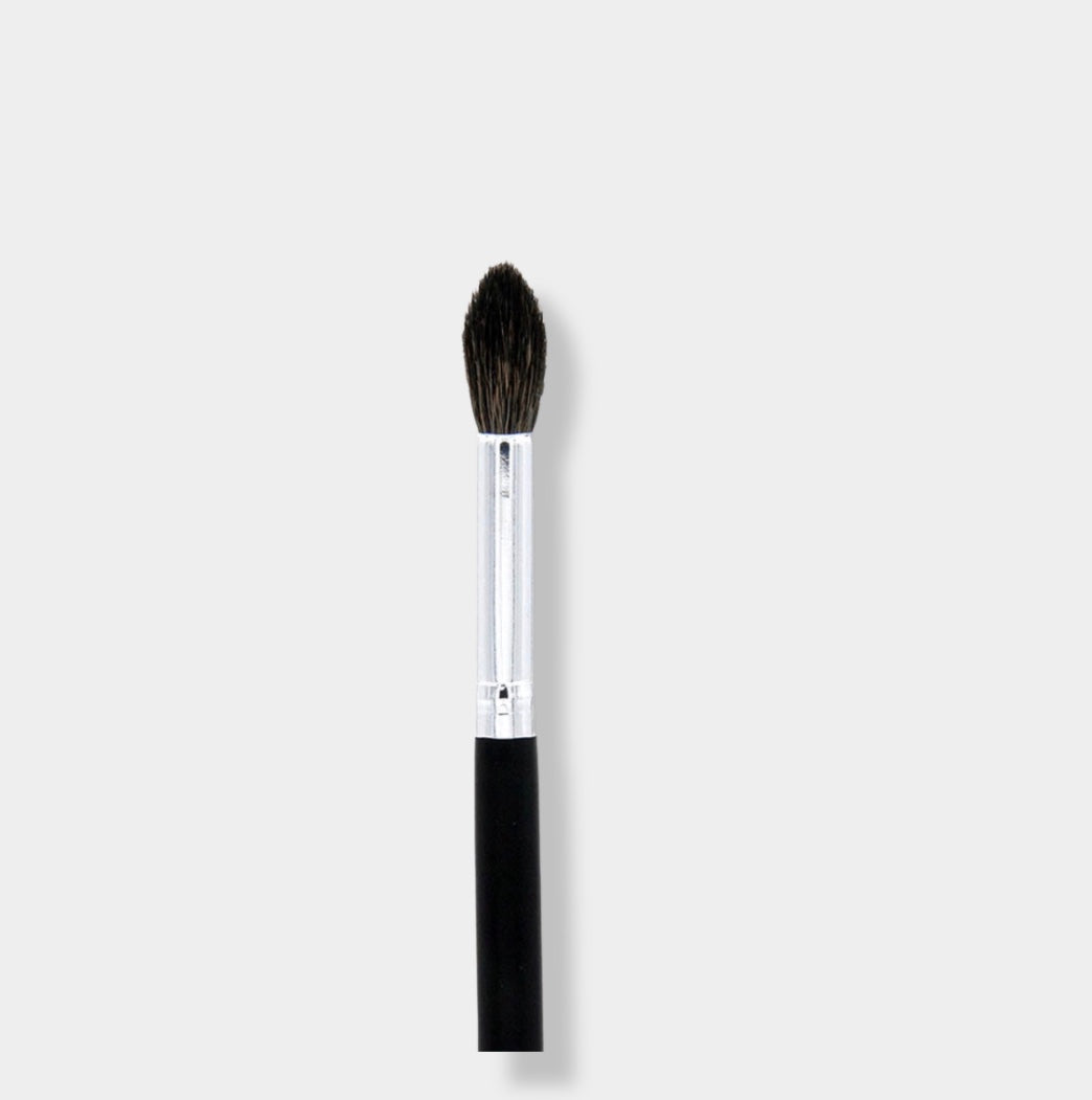 Jenn of Arch Sculpting Crease Brush with tapered bristles for precise eyeshadow blending and crease definition.