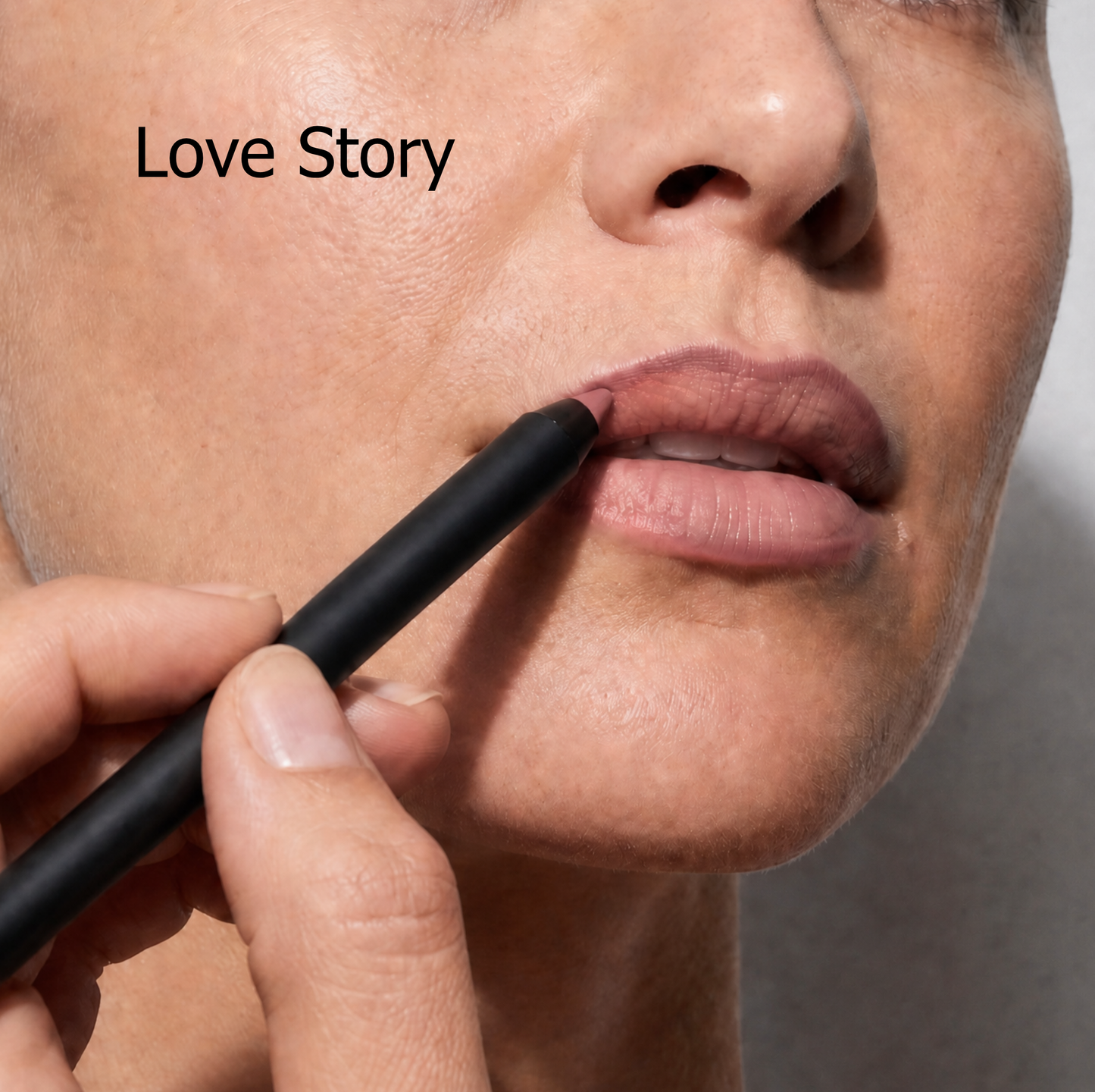 Close-up of Jenn of Arch Ultimate Waterproof Lip Liner being applied to lips, showcasing precise application and smooth texture on models lips