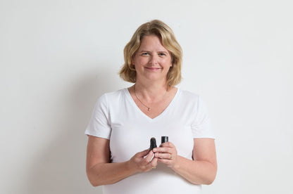 Woman using the Jenn of Arch Bold Brow Duo Stencil Kit to shape and define her eyebrows.