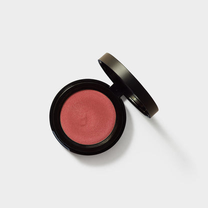 Jenn of Arch Cream Cheek and Lip Tint blush, showing a close-up of the creamy application on skin with a soft, natural pink hue.