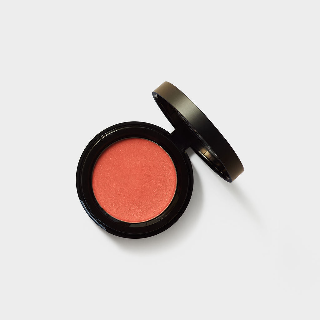 Jenn of Arch cream cheek and lip tint blush in a sleek tube, showcasing a soft pink shade for cheeks and lips.