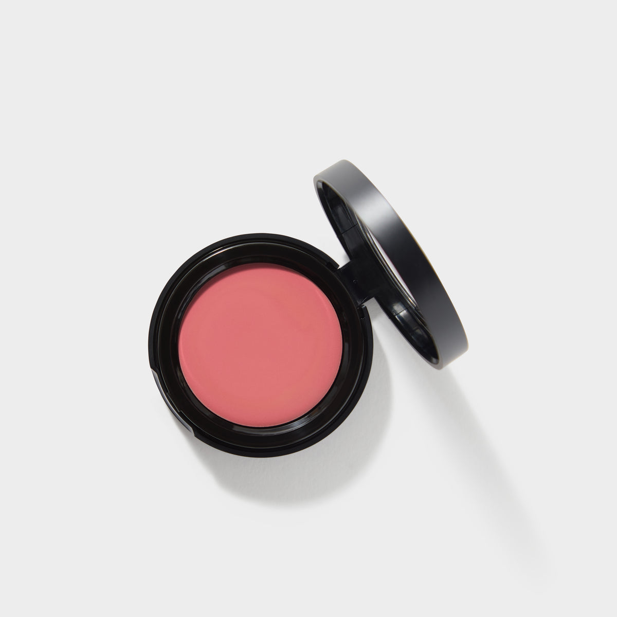 Jenn of Arch cream blush and lip tint in a compact container with a creamy pink shade and smooth texture for cheeks and lips.