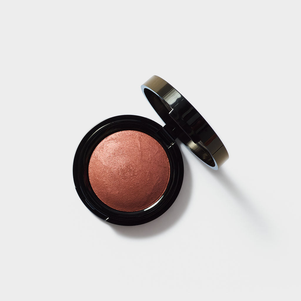 Jenn of Arch Sweet Cheeks Baked Blush, a rose gold powder blush in a compact for natural, radiant cheeks.