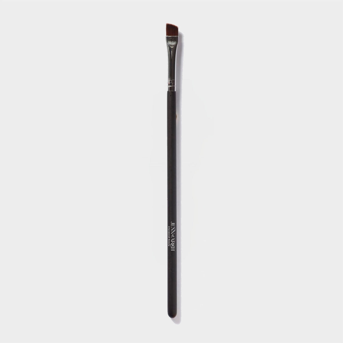 Jenn of Arch angled liner brush with sleek handle and fine bristles for precise eyeliner application or eyebrow fill