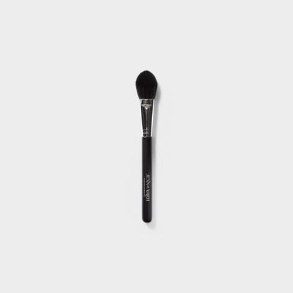 Jenn of Arch Pro Chisel Blush Brush with tapered bristles for precise application of blush and contour makeup.
