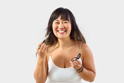 Jenn of Arch Pro Chisel Blush Brush with angled bristles for precise blush and contour application in makeup routines. Model is using the brush