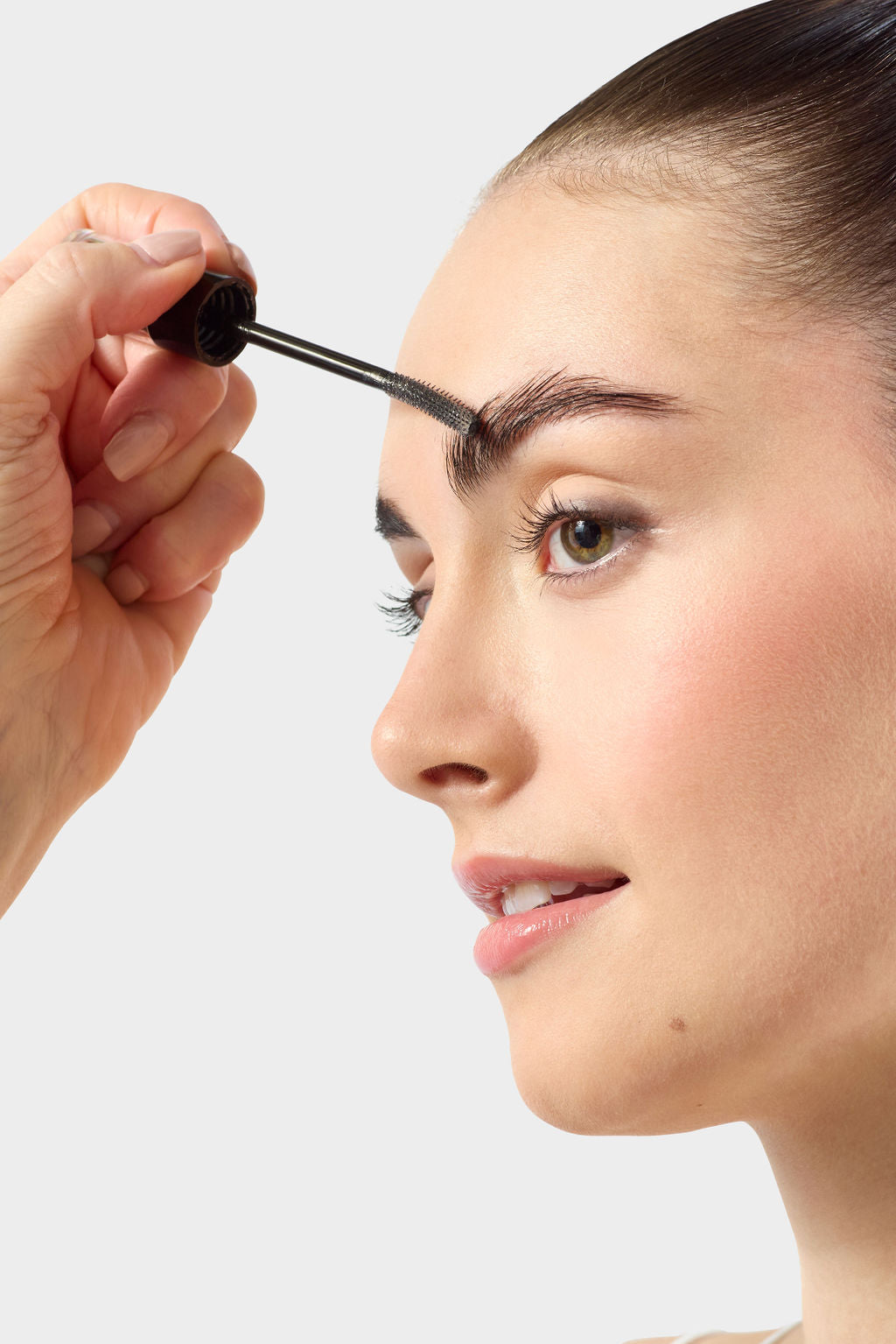 Jenn of Arch WOW Brow Gel being applied to model’s eyebrows, showcasing natural, defined brow enhancement.